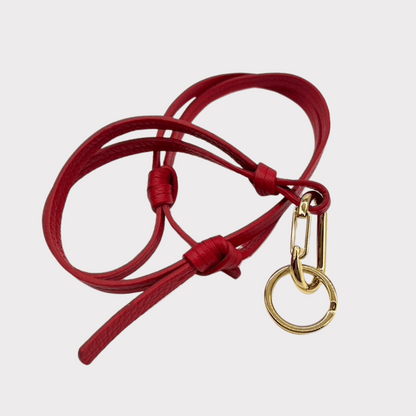 rotes verstellbares Ledertrageband mit goldenem Karabiner